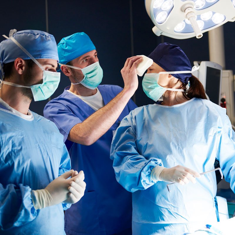 tired-surgeon-during-the-operation-at-night-2QNCUS9